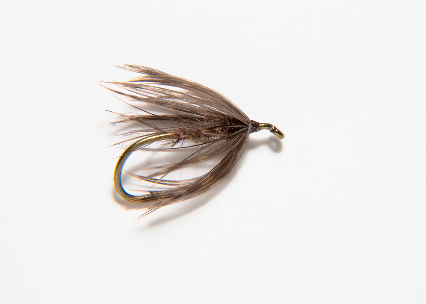 Here is a fly tied by my friend Galen Mercer, perhaps the finest fly dresser I know. Galen ties very much in the Catskill tradition, exemplified by the "neck" of bare hook shank between the eye and head of the fly. It takes a lot of control to master this technique and yet Galen makes it look simple. I believe that the hackle is NA Woodcock and the body is of hares' ear, but knowing Galen as well as I do there's probably some obscure bit of something else in the mix. Hardly what one would call a "classic" North Country Spider but a beautiful. effective, and perfectly dressed fly none the less.
